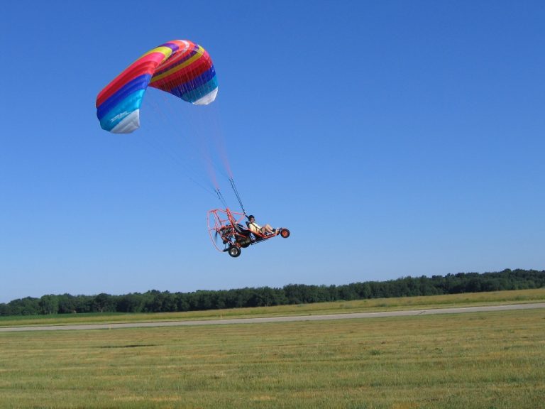 Infinity PPC taking off from airport with blue sky